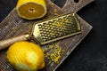 Grater peel and lemon zest Ready to Cook on black background, Long banner format. top view Royalty Free Stock Photo