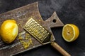 Grater peel and lemon zest Ready to Cook on black background, Long banner format. top view Royalty Free Stock Photo