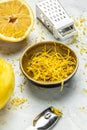 Grater peel and lemon zest Ready to Cook, vertical image. top view Royalty Free Stock Photo