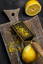 Grater peel and lemon zest Ready to Cook, vertical image. top view Royalty Free Stock Photo