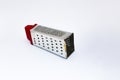 Grater with red handle isolated on white background. Royalty Free Stock Photo