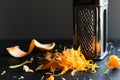 grater and shreds of orange peel for cocktail garnish Royalty Free Stock Photo