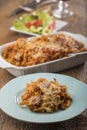 Gratinated pasta on wood Royalty Free Stock Photo