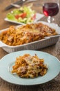 Gratinated pasta on wood Royalty Free Stock Photo