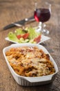 Gratinated pasta on wood Royalty Free Stock Photo