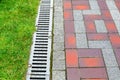 Grating of drainage system rainwater in the park. Royalty Free Stock Photo