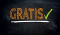 Gratis in german free of charge blackboard concept background Royalty Free Stock Photo