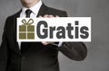 Gratis in german Free of Charge shield is held by businessman Royalty Free Stock Photo