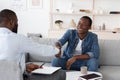 Gratittude For Work. Black Man Handshaking With Psychologist After Therapy Session Meeting Royalty Free Stock Photo