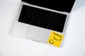 Gratitude Message on a Bright Yellow Sticky Note with a Simple Smiley Face on a Modern Laptop Royalty Free Stock Photo