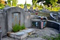 Grave of Chinese married couple together with ornate tombstone at cemetery graveyard Ipoh Malaysia