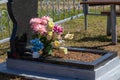 grave with flowers close-up