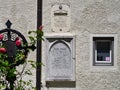 The grave of Franz Gruber, the composer of the song Silent Night, and the facade of his museum house with panels, Hallein, Austria