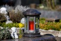 Grave lantern with red candle and angel Royalty Free Stock Photo