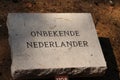 Grave stone named Onbekende Nederlander unknown Dutch in the field of honour in Loenen, where soldiers, resistance members, poli