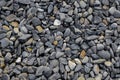 Gravel background with small and medium size gray and dark yellow stones