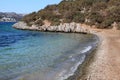 Gravel beach on the coast of Bitez peninsula in Gulf of Gokova near Bodrum in Turkey. Royalty Free Stock Photo