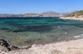 Gravel beach and emerald water of Aegean sea in Gulf of Gokova. Royalty Free Stock Photo