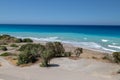 Gravel beach at Kiotari on Rhodes island, Greece with water in different colours