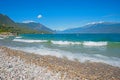 gravel beach Toscolano, lake shore Gardasee, tourist summer destination italy Royalty Free Stock Photo