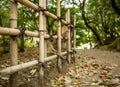 Gravel footpath in the Ritsurin Koen-Chestnut Grove Garden between bamboo fences Royalty Free Stock Photo