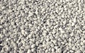 Gravel of gray-speckled white pebbles. Background and texture