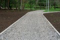 Gravel path in a summer park. Fork in the road Royalty Free Stock Photo