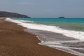 Gravel / pebble beach at the westcoast of Rhodes island near Kattavia with ocean waves Royalty Free Stock Photo