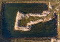 Gravel pit with an arrow-shaped headland Royalty Free Stock Photo