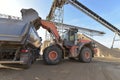 Gravel pit: building and wheel loader loading gravel onto a truck Royalty Free Stock Photo