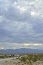 Monsoon rain clouds over mountain range edge of dry Mojave Desert valley Nevada, USA Royalty Free Stock Photo