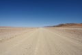 Gravel Road into Desert Royalty Free Stock Photo