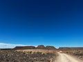 Gravel road in desert. Sandy landscape, nobody. Nature in Namibia, Africa