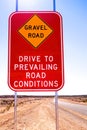 Gravel Road: Drive to prevailing road conditions sign in outback Australia. Royalty Free Stock Photo
