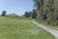 gravel road on green shore at Rottachsee Alpine lake, Oy-Mittelberg, Germany