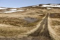 Gravel road leading up a mountain