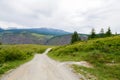 Gravel road in a mountain valley at the top of the Altai Mountains Summer Royalty Free Stock Photo