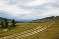 Gravel road in a mountain valley at the top of the Altai Mountains Royalty Free Stock Photo