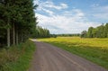 Gravel Road by Open Field Royalty Free Stock Photo
