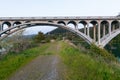 A gravel road runs under the Rogue River Bridge at Gold Beach, Oregon, USA Royalty Free Stock Photo