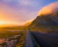 Gravel road at sunset with Vestrahorn mountain in the background, Iceland Royalty Free Stock Photo