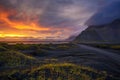 Gravel road at sunset with Vestrahorn mountain in the background, Iceland Royalty Free Stock Photo