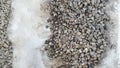 Gravel Road Texture Covered With Snow Winter Time. Pebble Pattern, Crushed Stone Concept