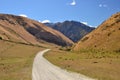 Gravel road to mountains, New Zealand, Queenstown Royalty Free Stock Photo