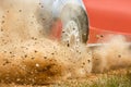 Gravel splashing from rally race car drift on track