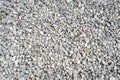 Gravel texture. Pebble stone background. Light grey closeup small rocks. Top Royalty Free Stock Photo