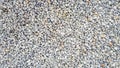 Gravel texture. Pebble stone background. Light grey closeup small rocks. Top Royalty Free Stock Photo