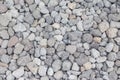 Gravel texture. Pebble stone background. Light grey closeup small rocks. Top view of ground gravel road Royalty Free Stock Photo