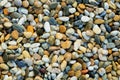 Gravel texture. Small stones, little rocks, pebbles in many shades of grey, white, brown, blue, yellow colour. Background of small Royalty Free Stock Photo