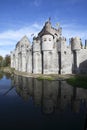 Gravensteen castle in Gand reflects in the water.